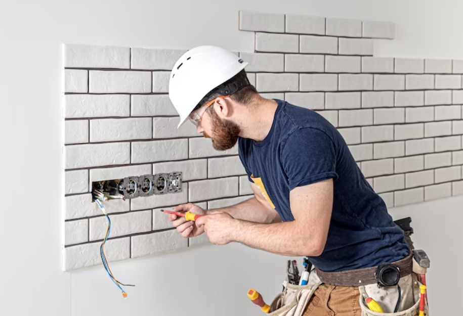 A Blu worker completing skilled electrical work